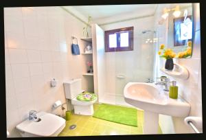 a small bathroom with a sink and a toilet at Terracitas 28 & 27 in Playa Blanca +16 photos