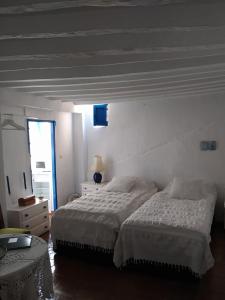 Posteľ alebo postele v izbe v ubytovaní Guesthouse La Tienda Cómpeta 21b