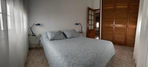 Łóżko lub łóżka w pokoju w obiekcie Casa Feluca