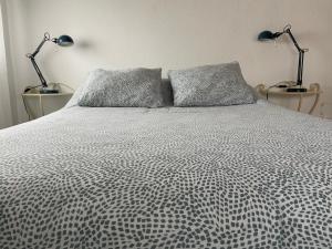 Łóżko lub łóżka w pokoju w obiekcie Casa Feluca