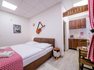 Posteľ alebo postele v izbe v ubytovaní Apartmany Style