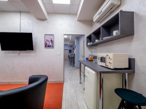 Kuchyňa alebo kuchynka v ubytovaní Apartmany Style