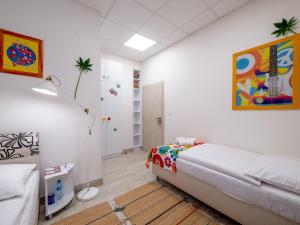 Posteľ alebo postele v izbe v ubytovaní Apartmany Style