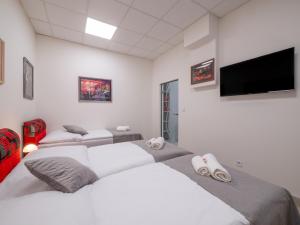 Posteľ alebo postele v izbe v ubytovaní Apartmany Style