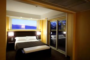 Letto o letti in una camera di E' Hotel
