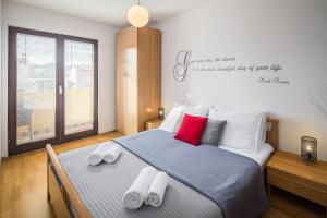 Posteľ alebo postele v izbe v ubytovaní Urban Premium Apartments