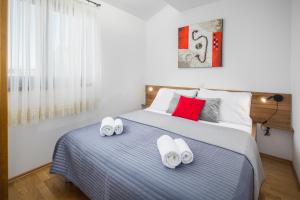 Säng eller sängar i ett rum på Urban Premium Apartments