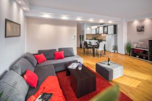 a living room filled with furniture and a couch at Urban Premium Apartments in Poreč