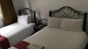 Voodi või voodid majutusasutuse Hotel Machupicchu Inn toas