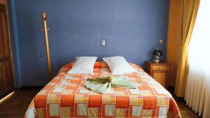 Postel nebo postele na pokoji v ubytování Hotel Utama