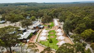 an aerial view of the resort with tables and umbrellas at The Woods Farm Jervis Bay in Tomerong