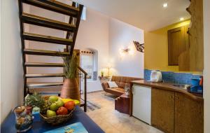 a kitchen with a bowl of fruit on a table at Lindos Boutique - Adults Only in Lindos