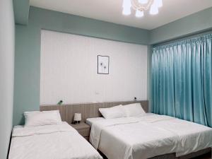 Voodi või voodid majutusasutuse Mo Dou Homestay toas