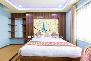En eller flere senger på et rom på Siddhartha Hotel Grand City