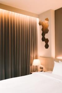 Postel nebo postele na pokoji v ubytování 56 Hotel