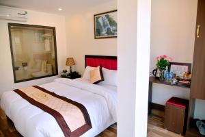 Postel nebo postele na pokoji v ubytování SAPA KING HOTEL HUNG VUONG HOTEl