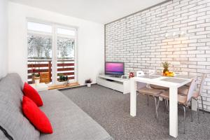 Televízia a/alebo spoločenská miestnosť v ubytovaní Apartment Labská 108 Špindlerův MLýn