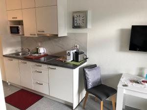 Kuchyň nebo kuchyňský kout v ubytování Apartment by Mario