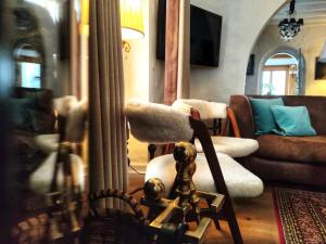 a living room with a chair and a couch at Coeur des Neiges in Saint-Gervais-les-Bains