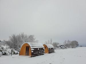 three tents in a field covered in snow at B&B La ferme du Château de Broich in Plombières