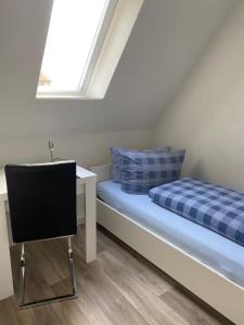 Postel nebo postele na pokoji v ubytování C&C Gästehaus Bückeburg