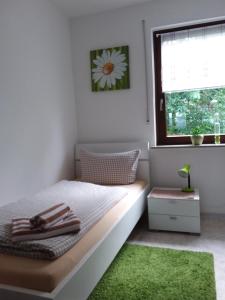 Postel nebo postele na pokoji v ubytování C&C Gästehaus Bückeburg
