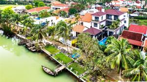 an aerial view of a house next to a river at Serene River Hoian in Hoi An