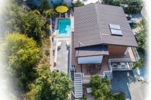 an overhead view of a house with a swimming pool at Apartments Kalaba - Dalma II in Podaca