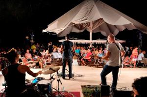 a group of people on a stage with a band at Belcekiz Beach Club - All Inclusive in Oludeniz