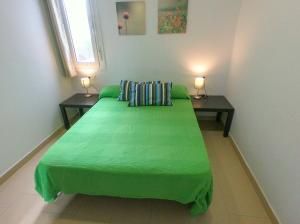 Postel nebo postele na pokoji v ubytování Noria is a comfortable apartment with patio and large terrace in Conil + 7 fotografií