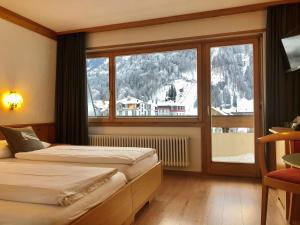 Voodi või voodid majutusasutuse Hotel Crystal toas