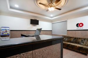a conference room with a laptop computer on a counter at Hotel Gayathri in Hyderabad
