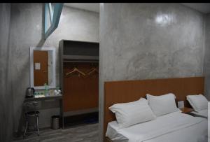 Letto o letti in una camera di Rick Resort Teluk Intan