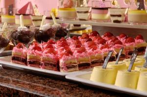 a display of desserts on trays in a buffet at Belcekiz Beach Club - All Inclusive in Oludeniz