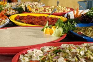 a table with many plates of food on it at Belcekiz Beach Club - All Inclusive in Oludeniz