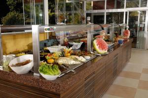 a buffet line with many different types of food at Belcekiz Beach Club - All Inclusive in Oludeniz