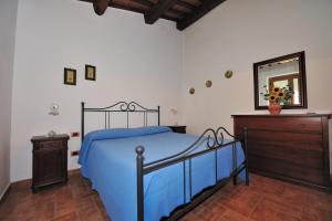 A bed or beds in a room at Agriturismo Il Morello