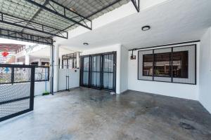 an empty room with windows and a fence at 3BR Family-Friendly Landed House,PandanPerdana,KL by Verano in Kuala Lumpur