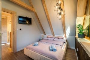 Posteľ alebo postele v izbe v ubytovaní DOMEK W UBOCY z widokiem na Giewont "Jacuzzi i Sauna w ofercie dodatkowo płatnej"
