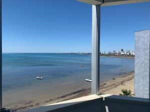 a view of a beach from a window at Kokomani in Durrës