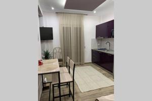 Η κουζίνα ή μικρή κουζίνα στο COMFORT AND SEAVIEW APARTMENT NEA PARALIA