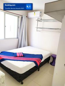 Cama o camas de una habitación en Lindo apartamento Avenida Brasil