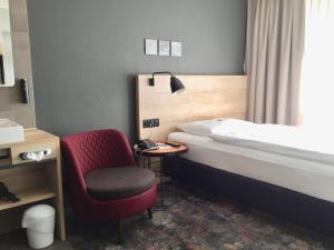 Postelja oz. postelje v sobi nastanitve Baxter Hotel