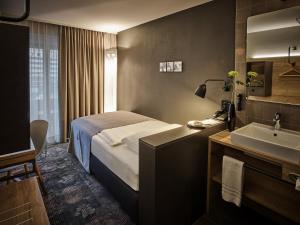 Postelja oz. postelje v sobi nastanitve Baxter Hotel