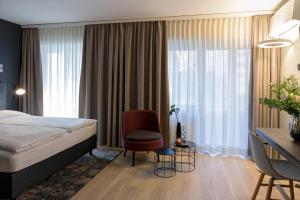 Postelja oz. postelje v sobi nastanitve Baxter Hotel