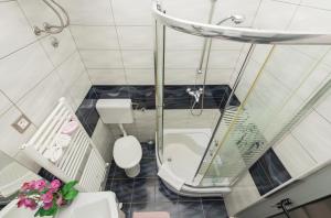 Koupelna v ubytování Premium Center Apartments
