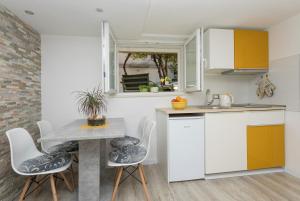 Kuchyň nebo kuchyňský kout v ubytování Premium Center Apartments