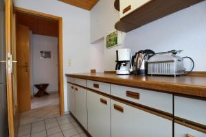 a kitchen with a counter top with a appliance on it at Ferienwohnung im Steinachtal in Nagold