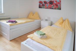 Łóżko lub łóżka w pokoju w obiekcie Linz LIVIA