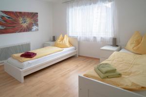 Łóżko lub łóżka w pokoju w obiekcie Linz LIVIA